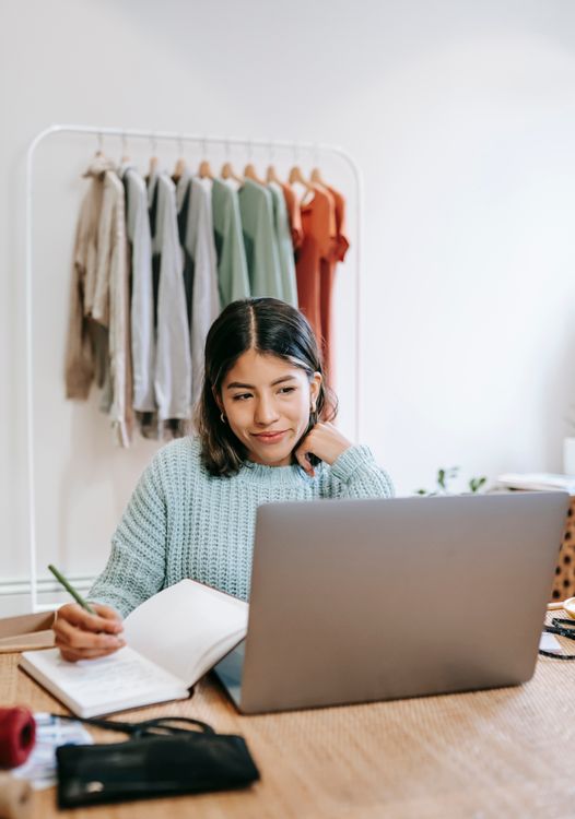 A small-business owner working with a laptop.